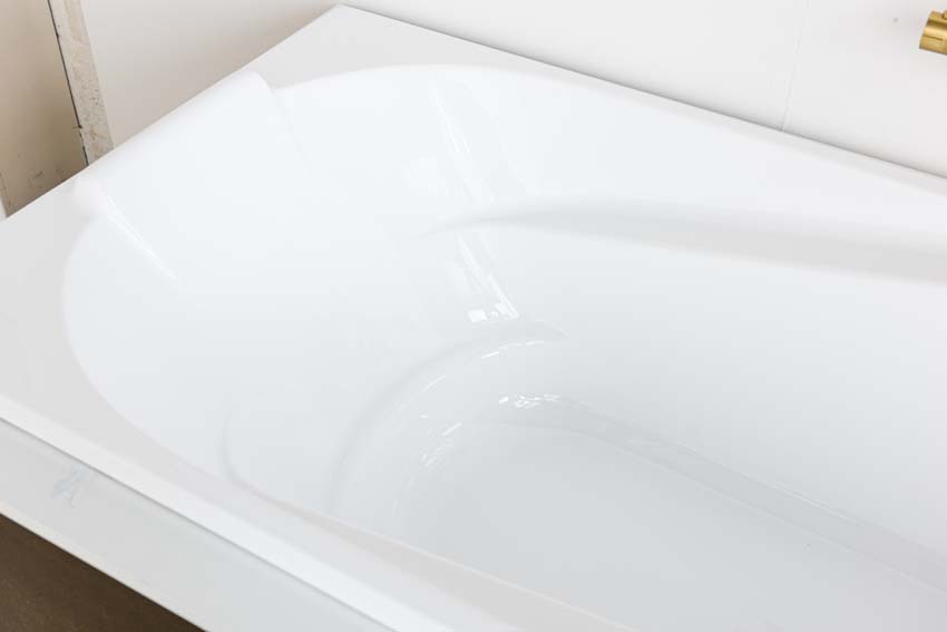 Baignoire encastrable Cora blanc brillant ergonomique 180x80cm + set de pieds réglables