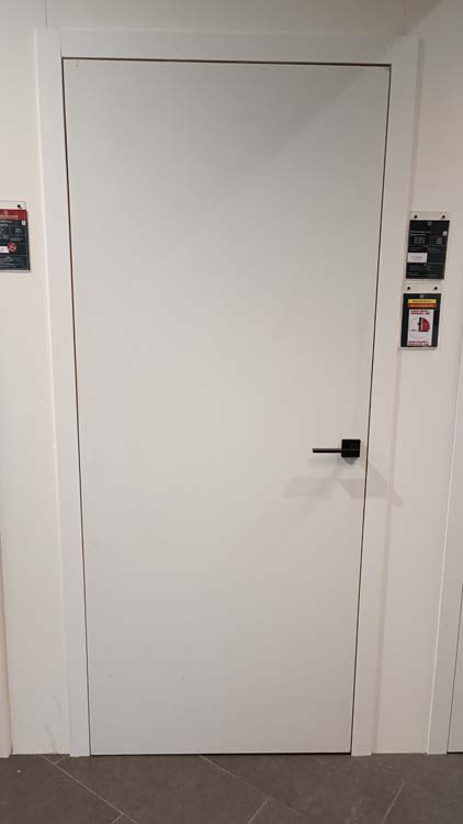 Bloc-porte fini invisible flat âme tubul.83cm à peindre 201.5cm rév.