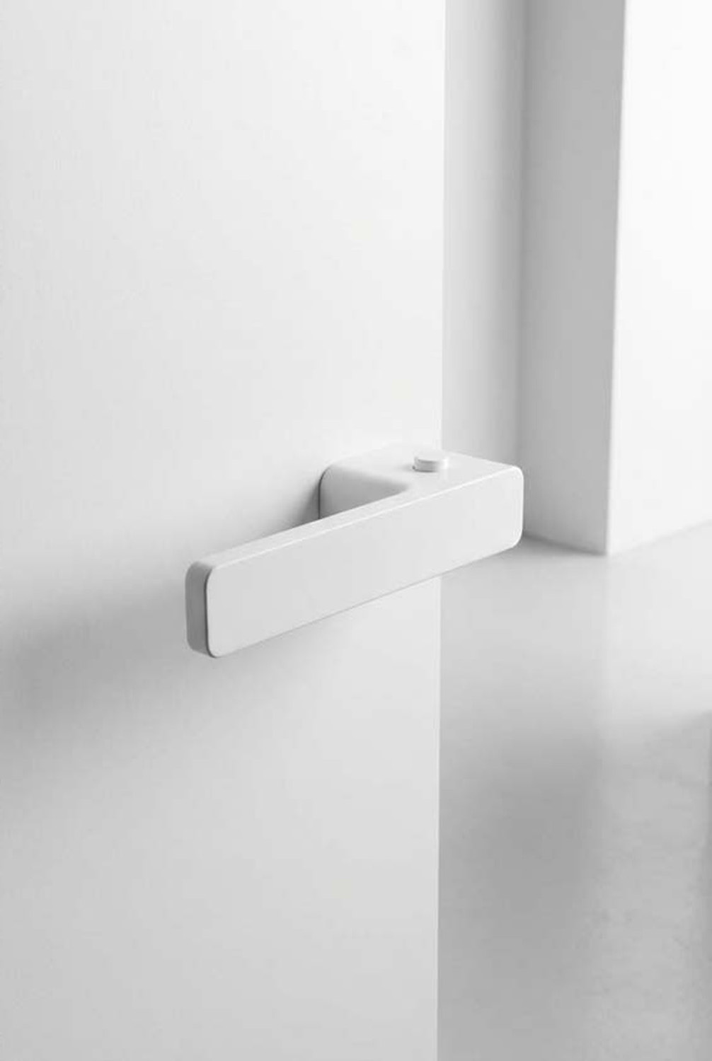 Deurkruk Xinnix vergrendelbaar linkswijzend wit gelakt complete set zonder rozetten