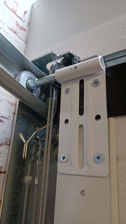 Porte sectionnelle Dora noire avec ressort de traction L2500xH2125mm